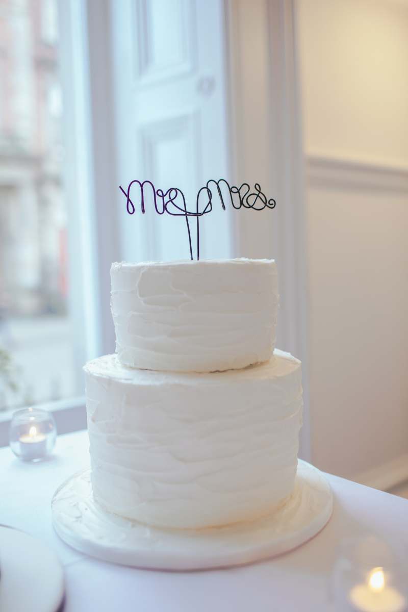 cake white 2-tier cake on white wooden table wedding cake