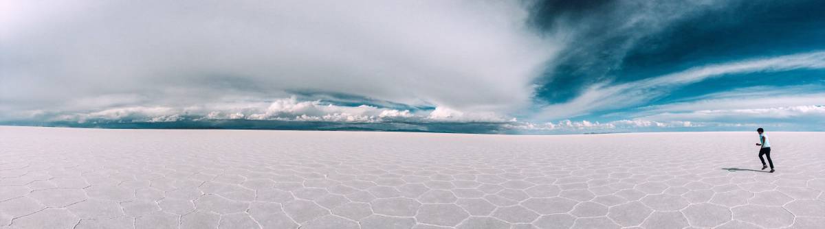 Person running on the salt flats beautiful landscape image 