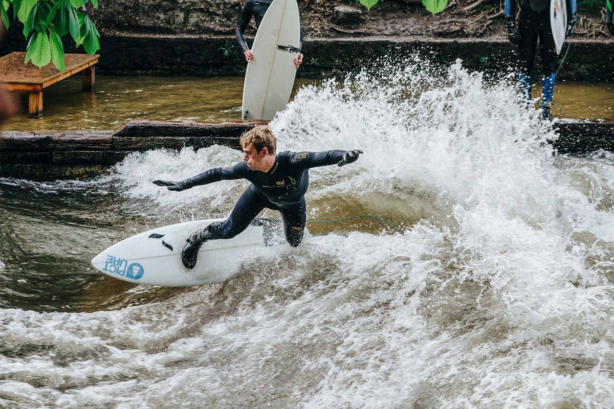 munich man riding surfboard and making tricks germany