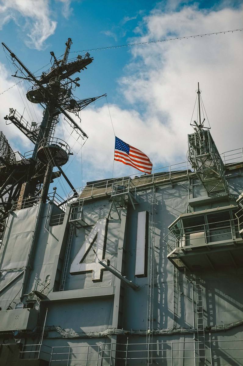 usa US flag on top of gray building san diego