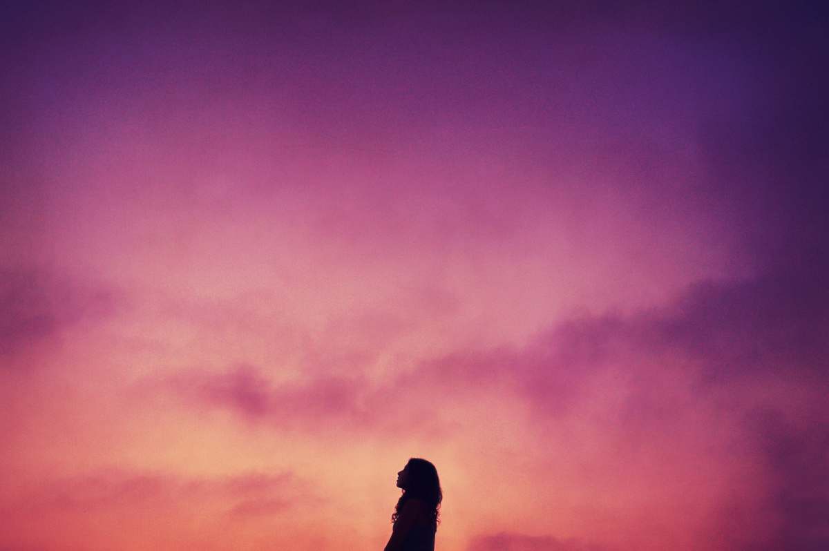 sunset silhouette of woman during sunset meditation