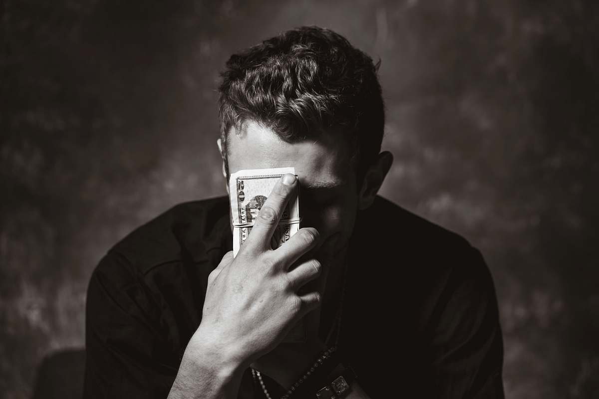  man holding banknote 