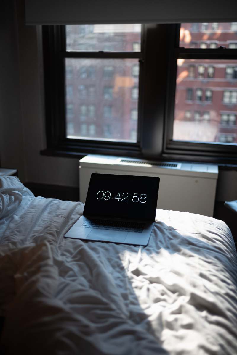 furniture black laptop computer turned-on displaying 09:42:58 pc