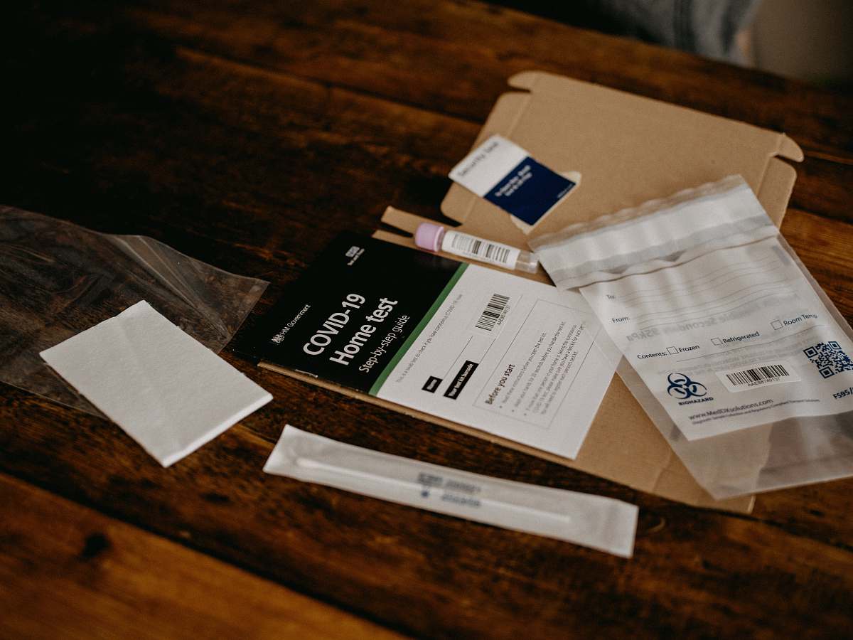 covid-19 white and black cigarette pack test tube