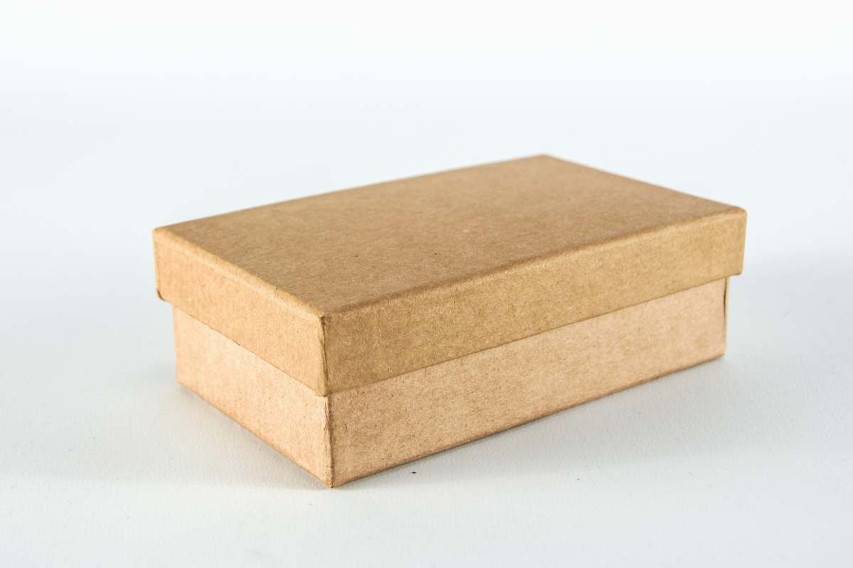 yellow brown cardboard box on white surface cardboard