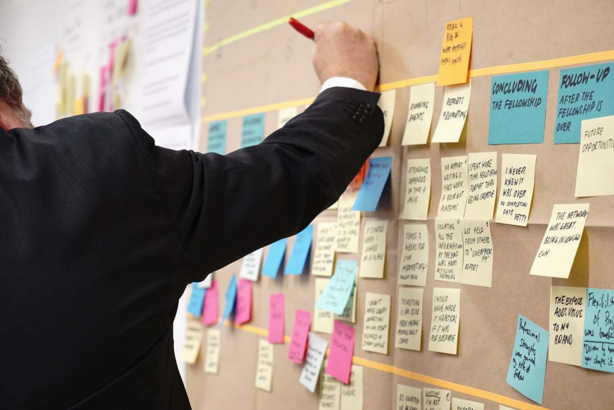 design sticky notes on corkboard learning and development