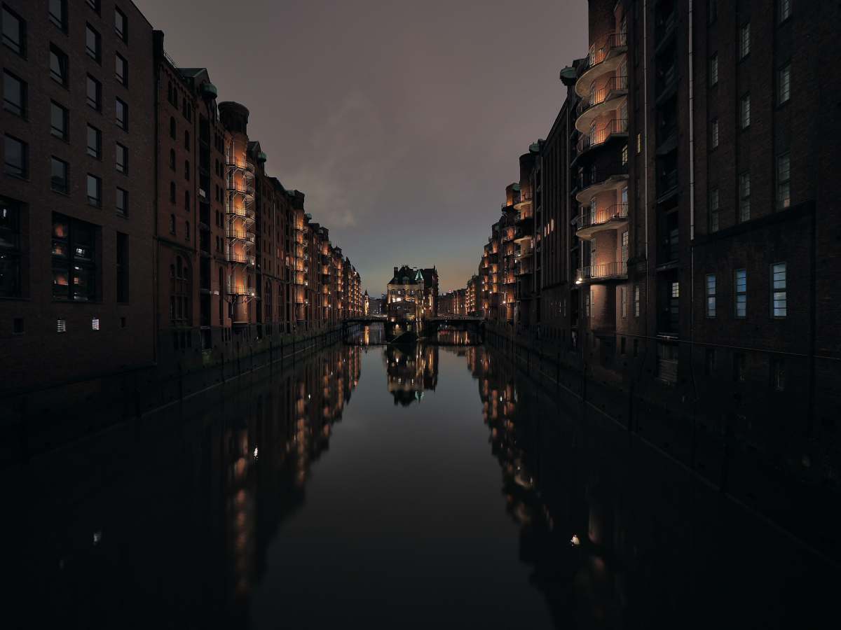 speicherstadt brown concrete building near body of water during daytime hamburg