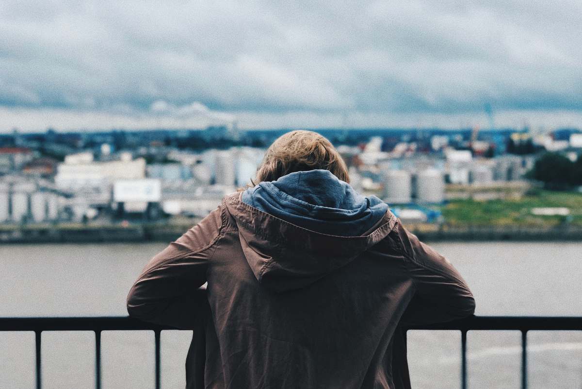 hamburg person standing near body of water elbphilharmonie hamburg