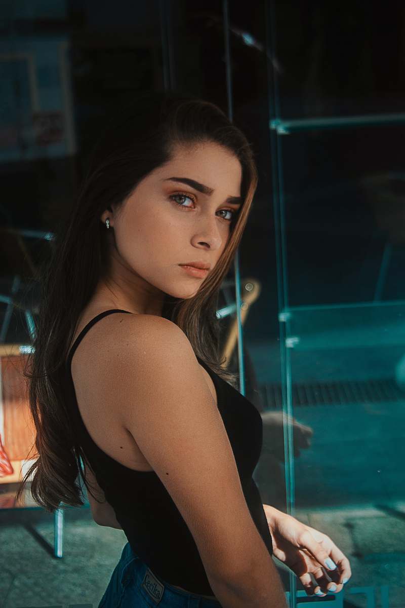  woman wearing black spaghetti strap top 
