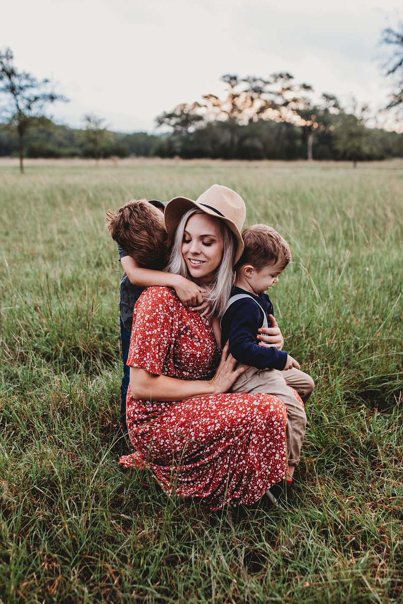clothing man and two children on grass field apparel