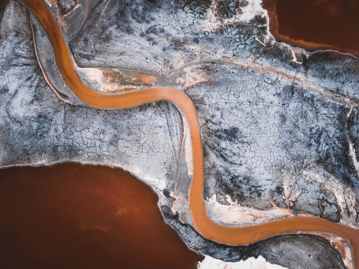 water aerial photography of river through valley mud