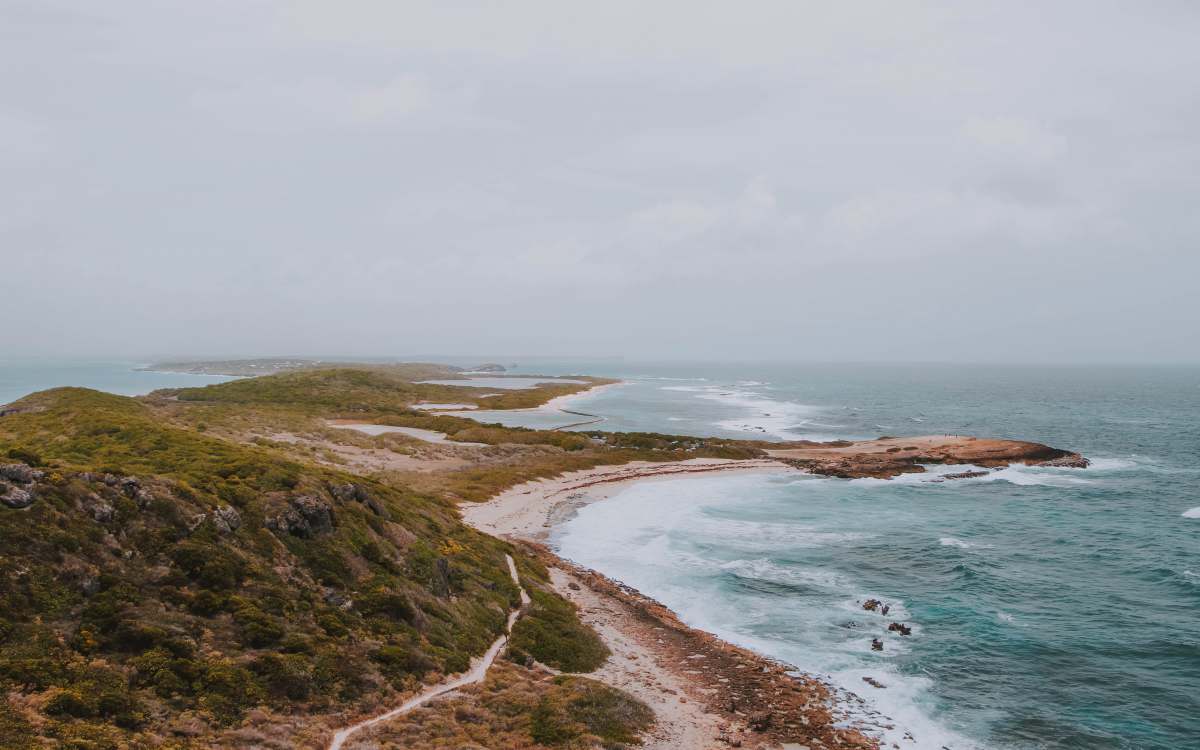 guadeloupe birds eye photography of mountain near body of water france