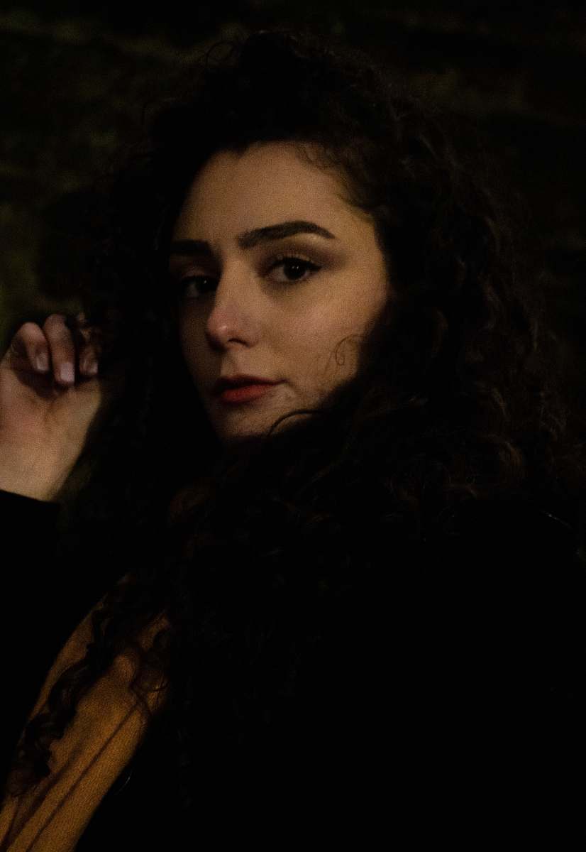 human woman in black and brown shirt person