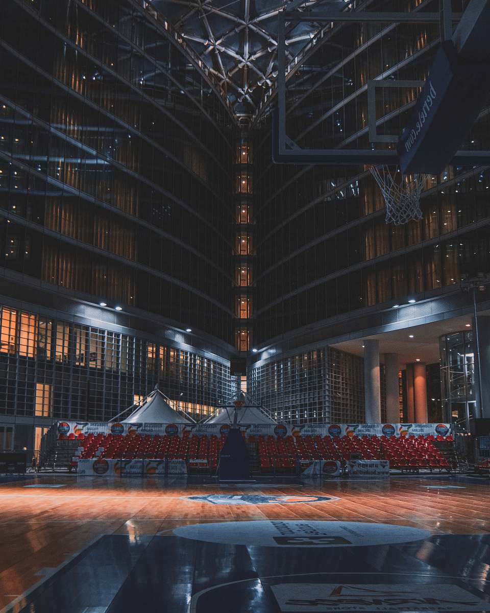 Experience the grandeur of this architectural masterpiece captured through stunning photography. This image showcases a spacious stadium filled with brilliant lighting, highlighted by a soaring ceiling and a vast stage. Perfect for event planning, sports marketing, or architectural design projects, this visual resonates with energy and excitement, making it an ideal choice for any creative endeavor.