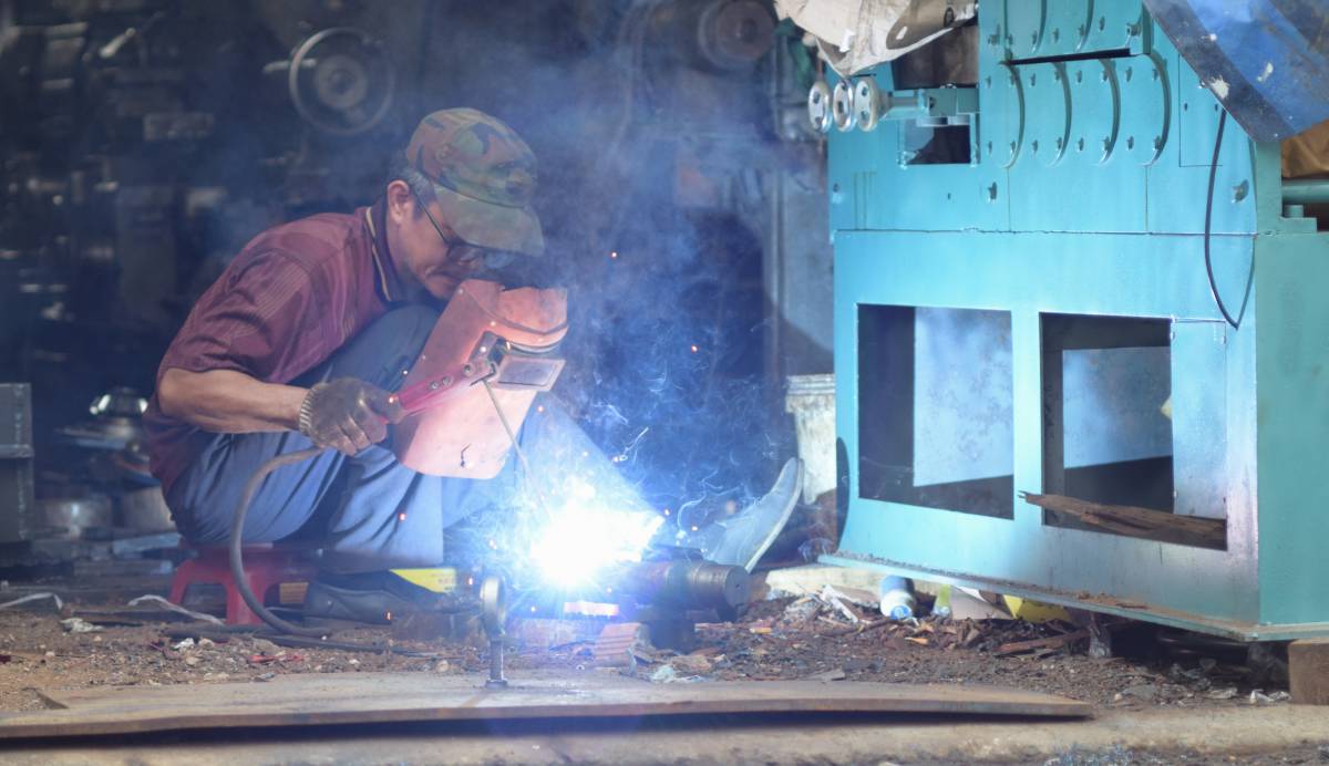 Experience the intensity of craftsmanship with this striking image of a man welding in a vibrant workshop. The scene captures the fiery sparks and action, showcasing the intricate process of metal manipulation. Perfect for industries related to manufacturing, engineering, and vocational training, this visual representation emphasizes skill, dedication, and the beauty of industrial work.