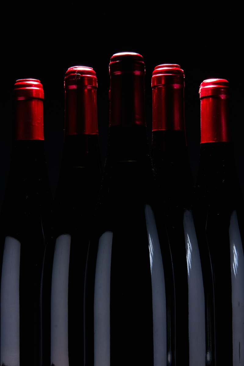 bottle five upright black bottles wine bottle