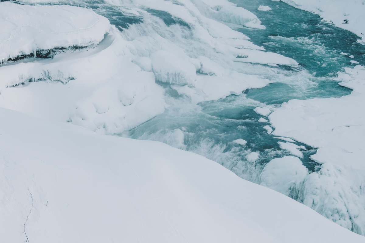 stream water covered by snow 