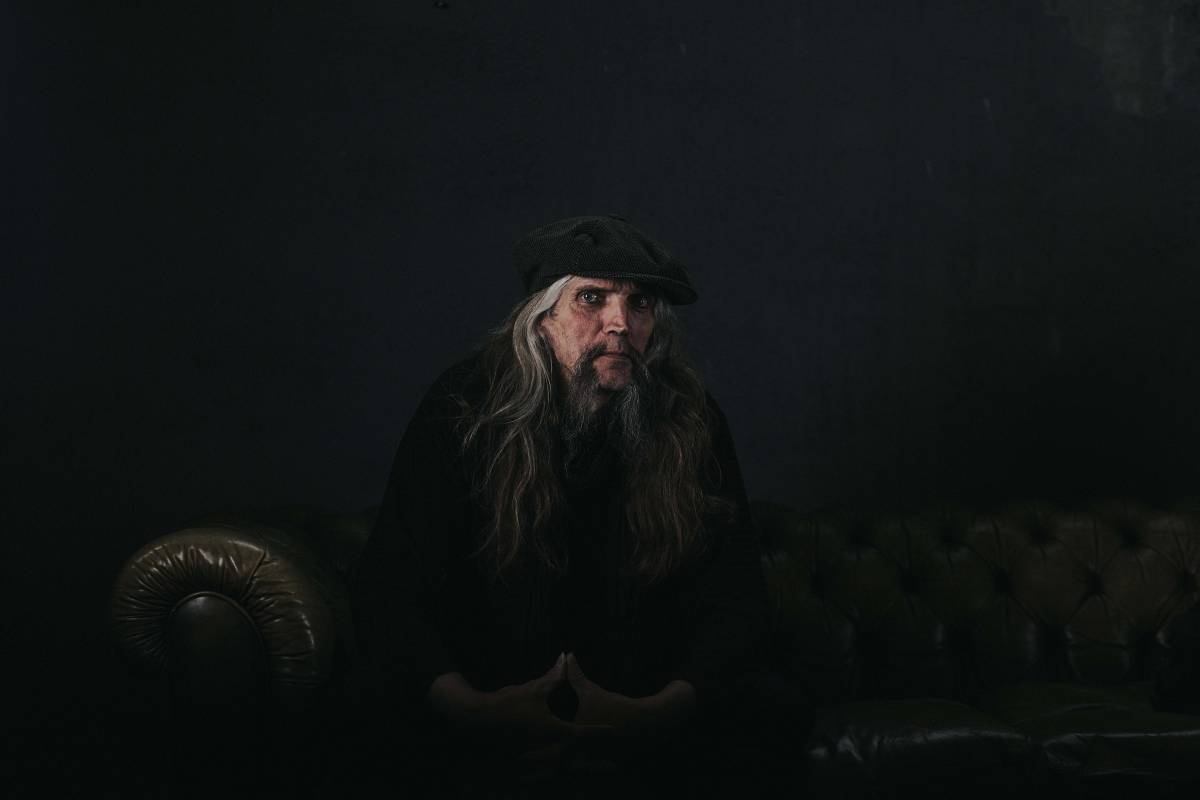 man man sitting on brown couch caucasian