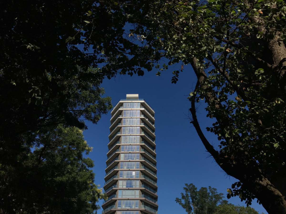 a tall building with a glass facade