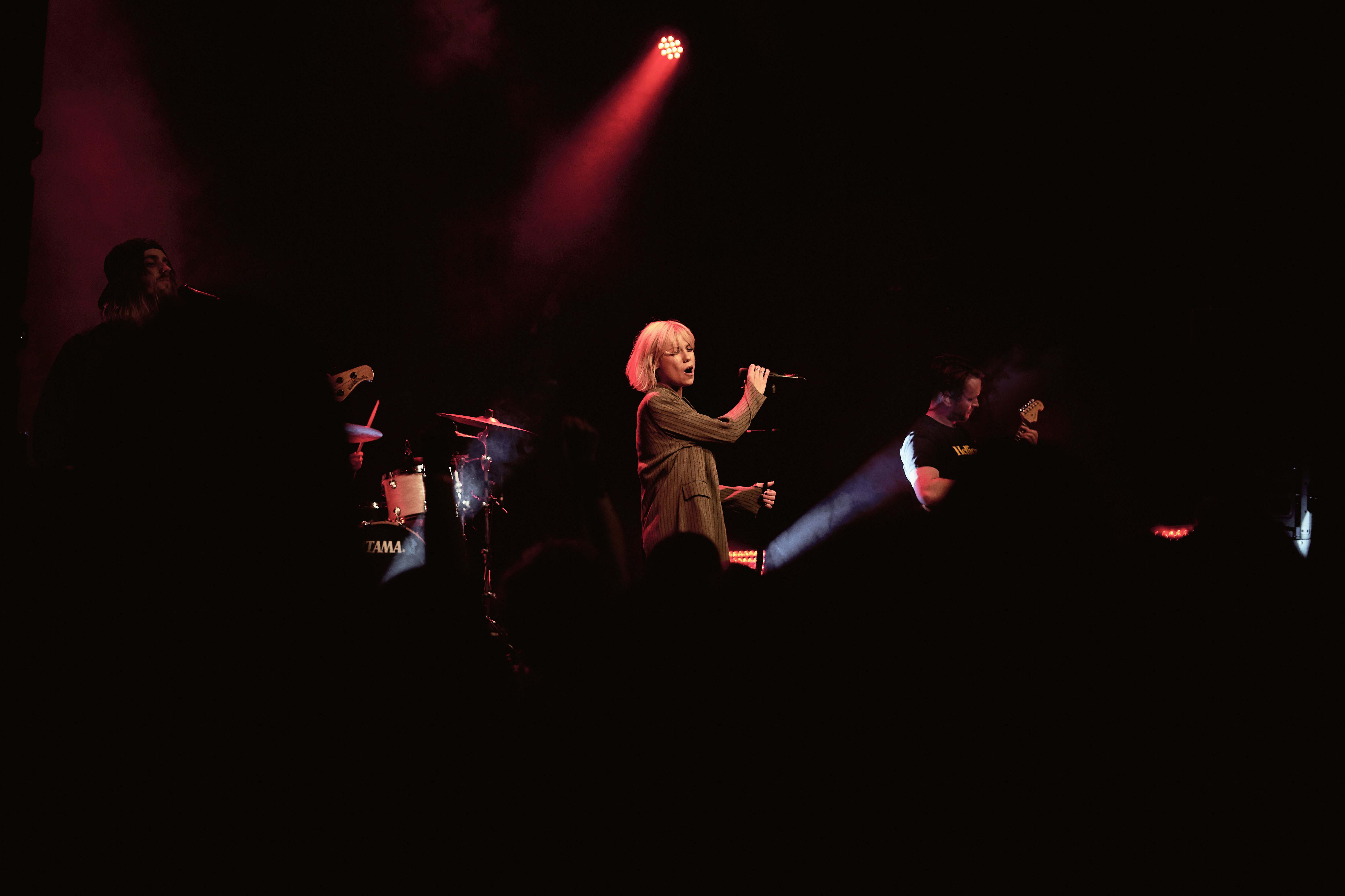 Lighting Woman Holding Microphone Stage Image Free Photo