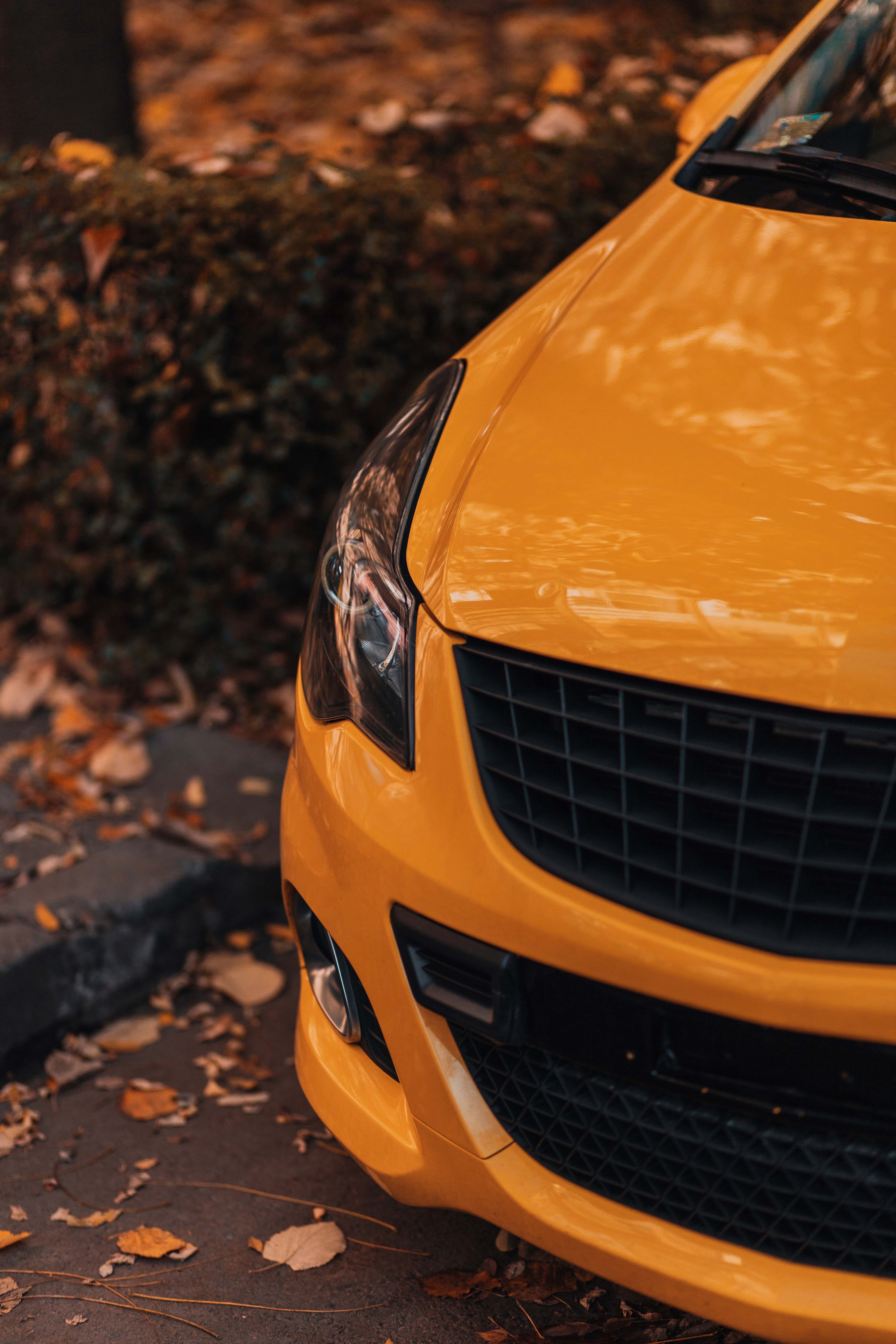 Yellow Car On Brown And Black Concrete Floor Image Free Photo