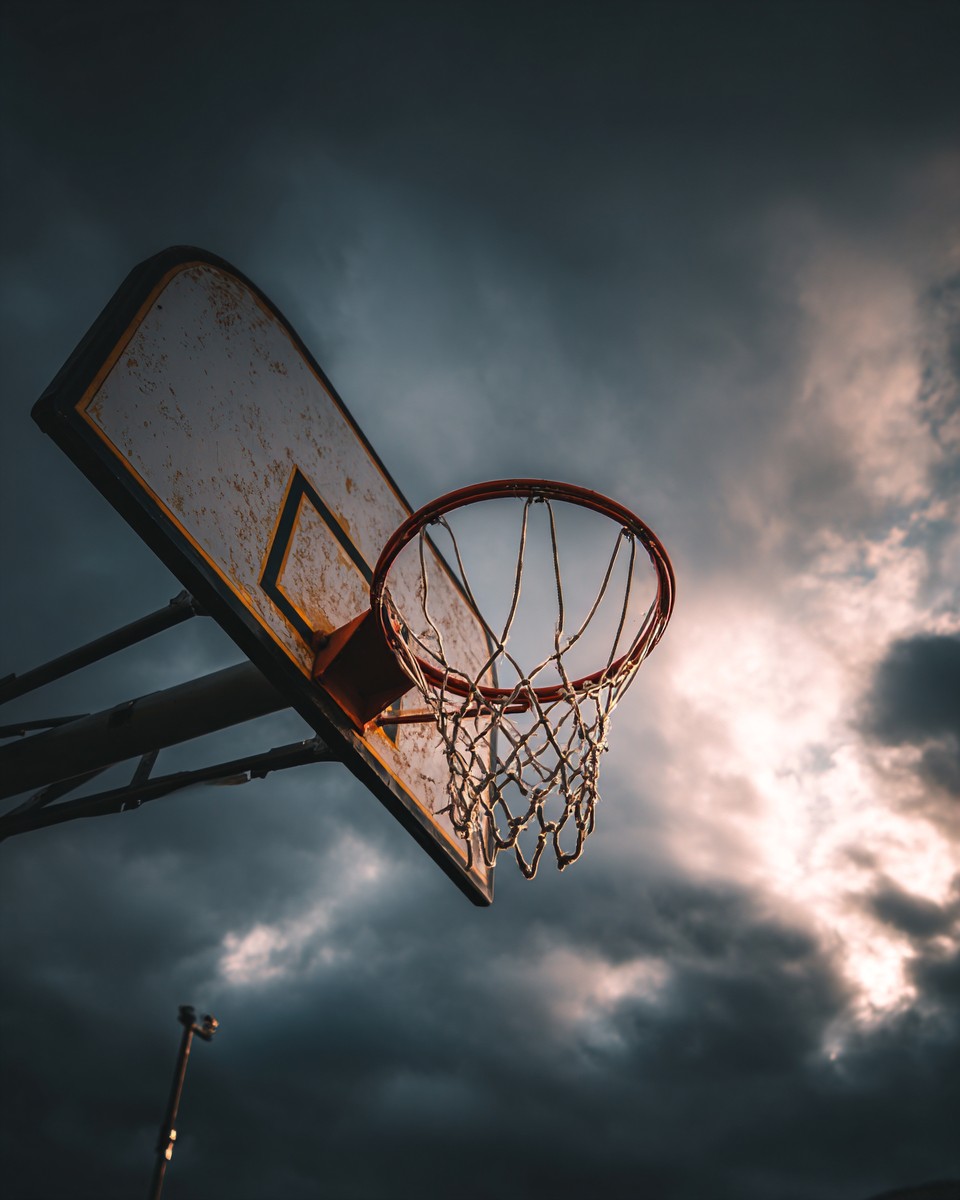 basketball hoop with dark clouds the background f0ebd58a 6b8e 470d