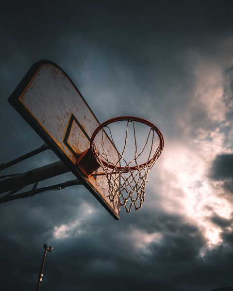 basketball hoop with dark clouds the background f0ebd58a 6b8e 470d