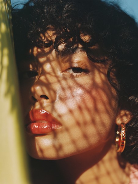 Intriguing Portrait of Asian Woman with Curly Hair