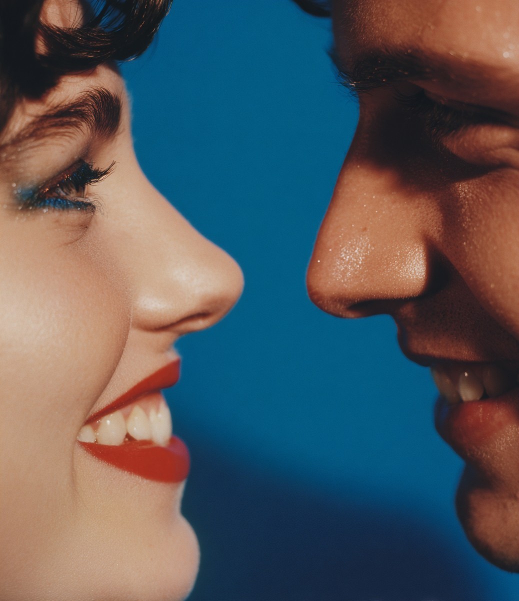 close smiling woman and man flirting with