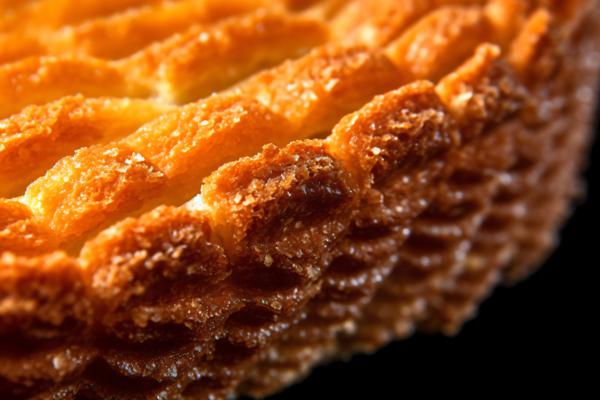 A close-up of a golden-brown pie crust