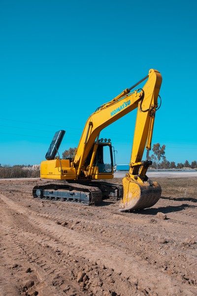 Yellow Komatsu Excavator on Dirt Field