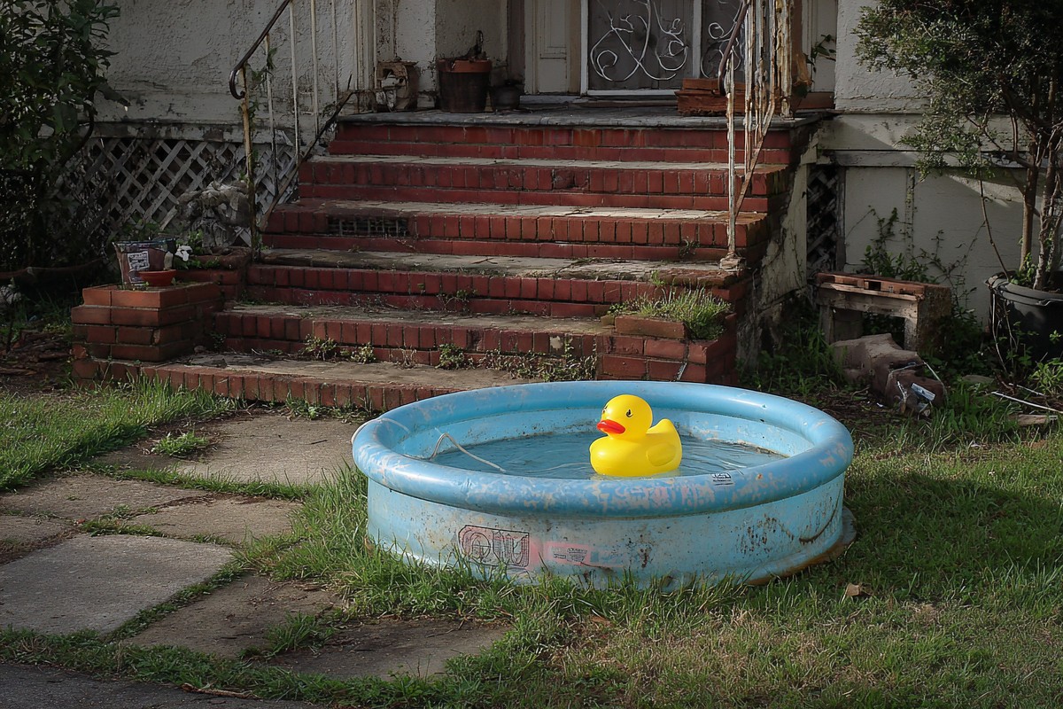 front yard with plastic pool and rubber duck faded a14b09ee