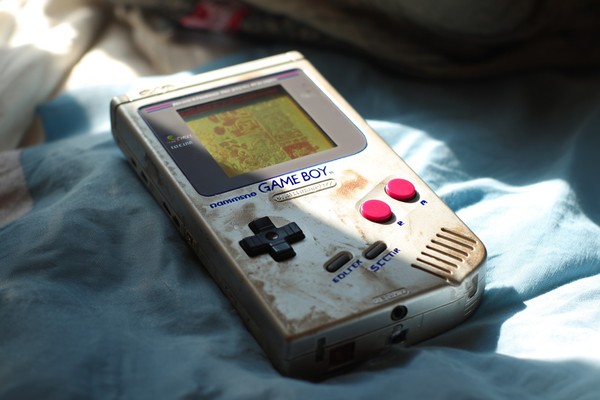 game boy with scratched screen and sticker soft