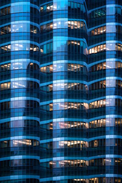 The geometric patterns formed by a cluster of glass-windowed business towers