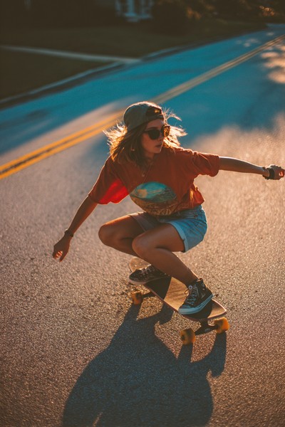 girl power teen girl skateboarding down hill 5191c3bb aa24 4773