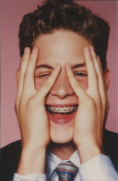 handsome young man wearing braces showing off cd07d5e1 2c21 4e66
