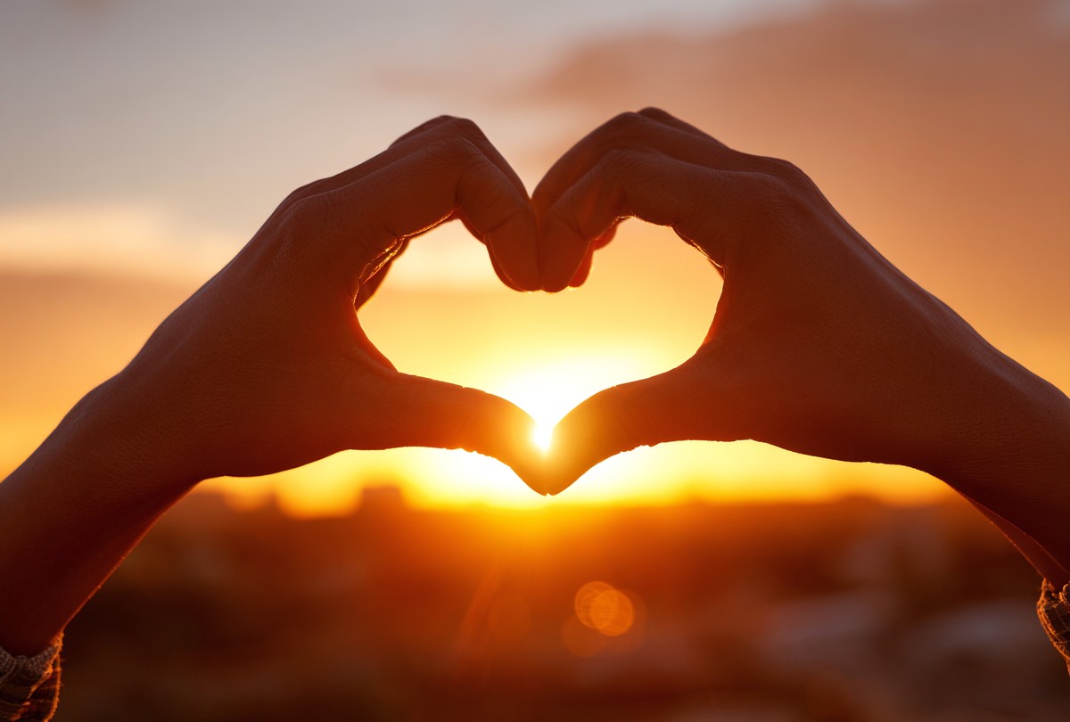 heart shape formed two hands against the back b5fc0623 e5a1
