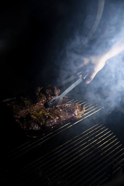 Culinary Focus on Kamado Grill with Meat Preparation