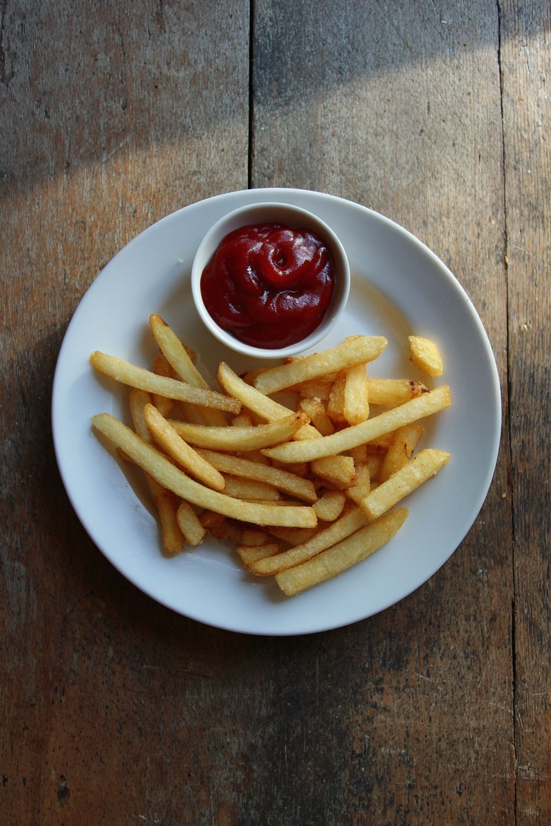 plate with leftover fries and ketchup smile wooden b3b8167b 7090