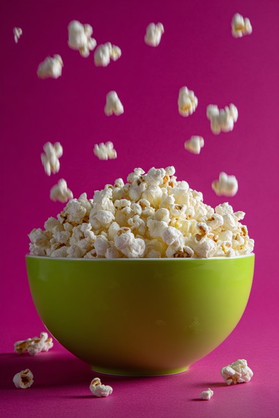popcorn lime bowl fuchsia background movie