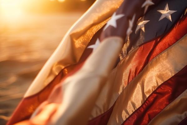 The United States flag gently waving in the golden sunset