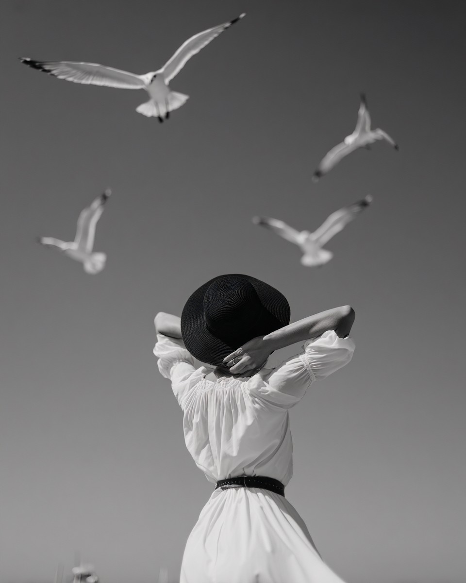 woman with her arms behind her head facing away 6d4edfc0