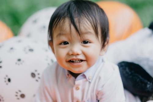 prebirthday girl in pink button up shirt smiling shoot