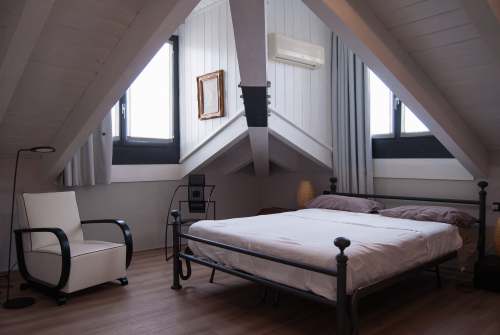 milan black steel bed frame near window italy