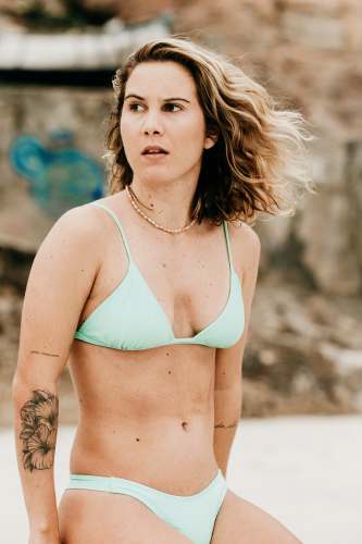 person woman in green bikini top female
