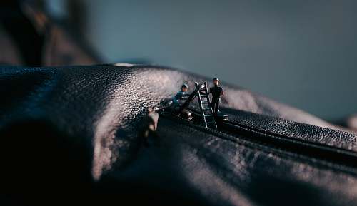 cinematography black leather textile with black zipper zipper
