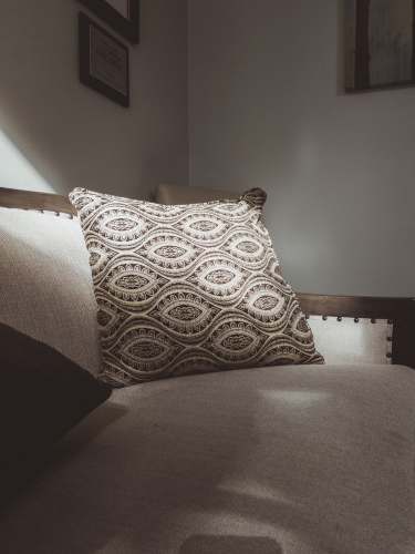 cushion grey and white throw pillow on sofa pillow