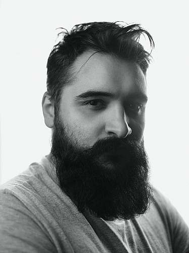 human man in gray shirt with black beard person