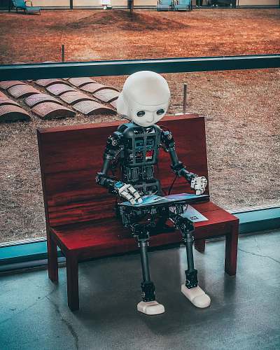 robot black and white robot toy on red wooden table seoul