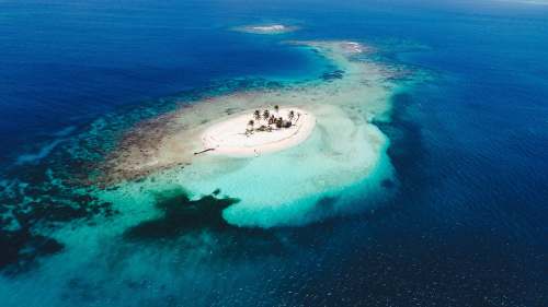 sea aerial photography of blue island island